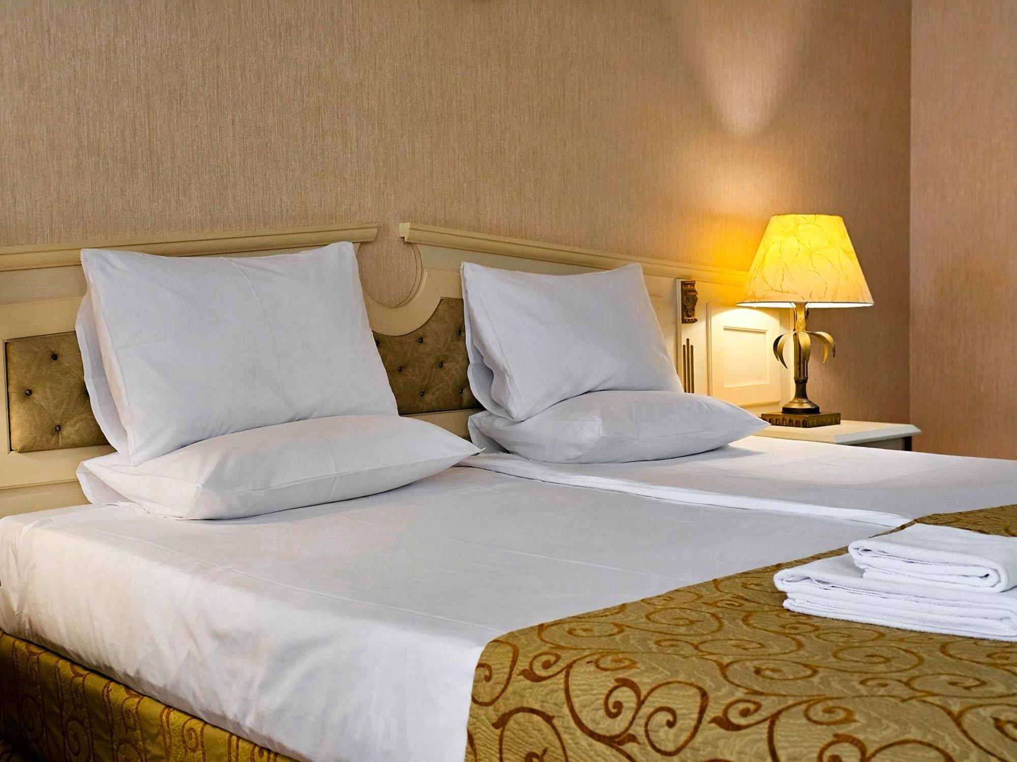 Imperial Palace Hotel Sunny Beach Exterior photo A bed with pillows and a lamp
